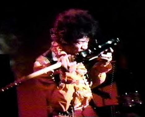 jimi hendrix playing with teeth.jpg